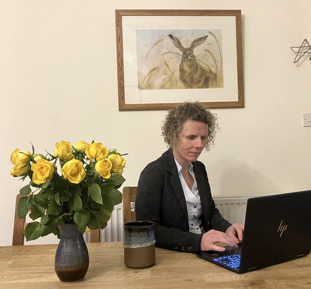 rachael at table on laptop